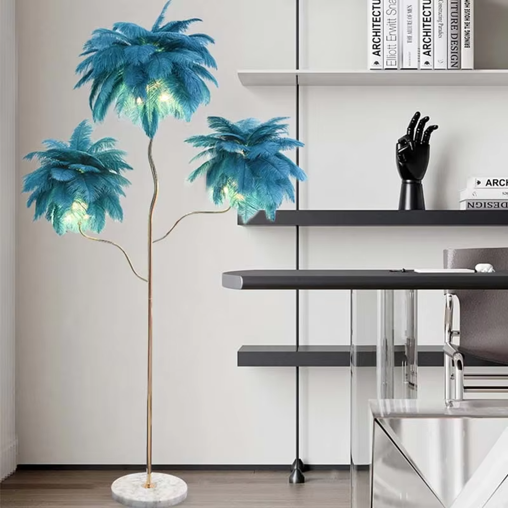 This is a light luxury soft feather-shaped floor lamp, equipped with three white feather lampshades, paired with a golden curved lamp pole and a marble base. The design is gentle and elegant, with soft and hazy lighting through the feathers. It is used for space lighting and decoration, creating a warm and soft light luxury atmosphere. Suitable for light luxury-style living rooms, bedrooms, internet-famous homestays and other places.