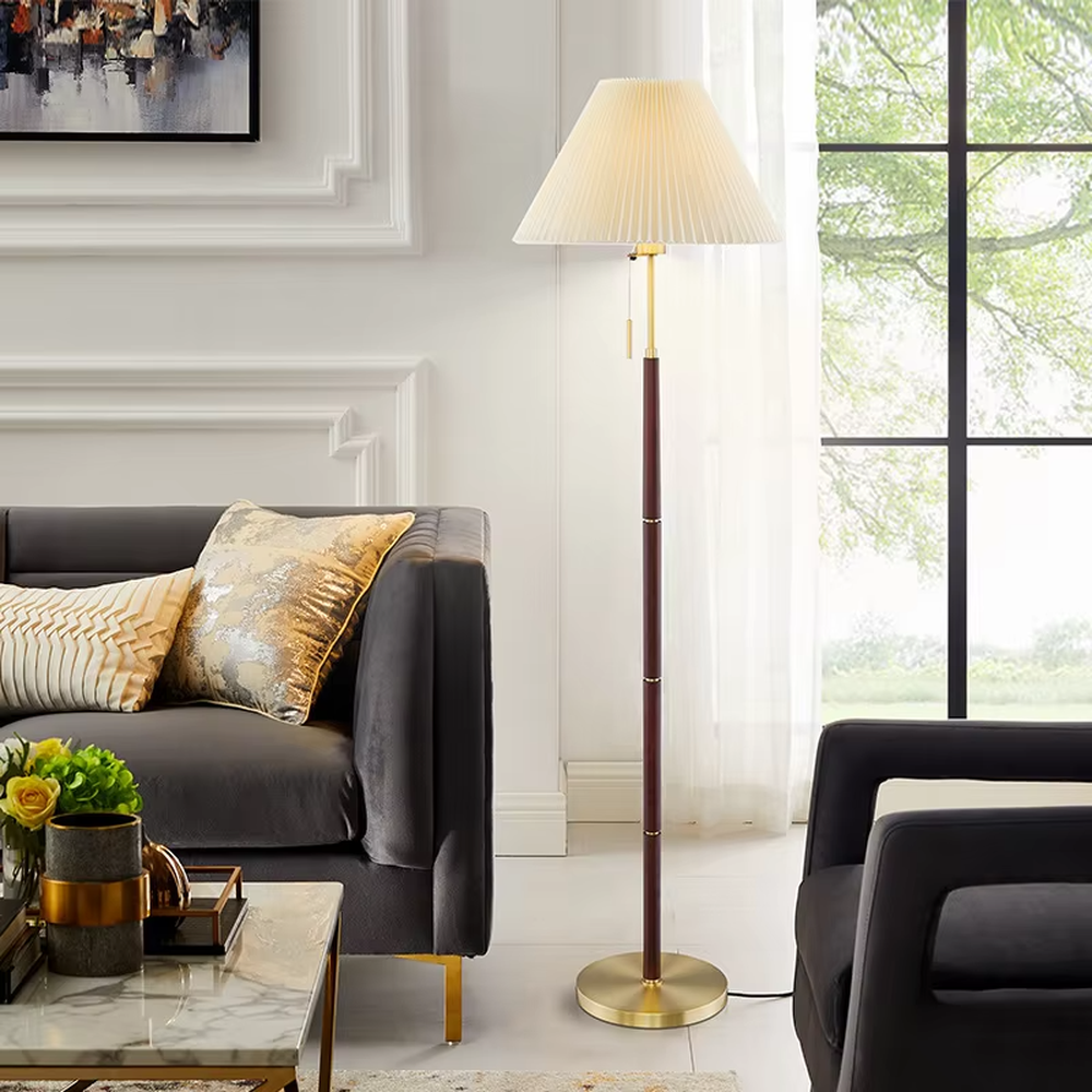 Light luxury vintage-style dark brown lamp pole gray pleated floor lamp, paired with golden decorations and base, soft and warm lighting, creating a high-end elegant space atmosphere.