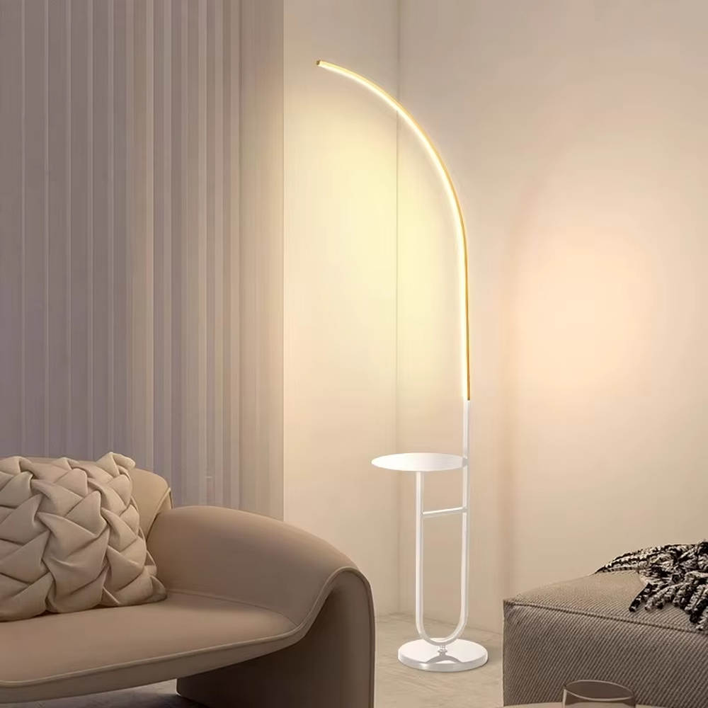Modern minimalist black metal curved LED floor lamp (with round small side table), soft and uniform warm light, creating a simple practical home atmosphere.