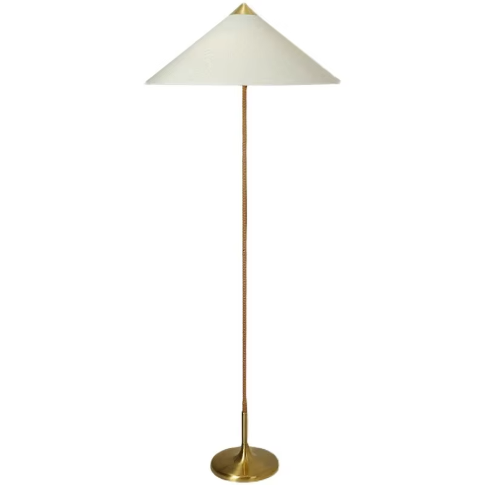 Light luxury vintage-style golden woven pole cone lampshade floor lamp, white cone fabric lampshade + golden disc base, soft lighting, creating an elegant vintage atmosphere.