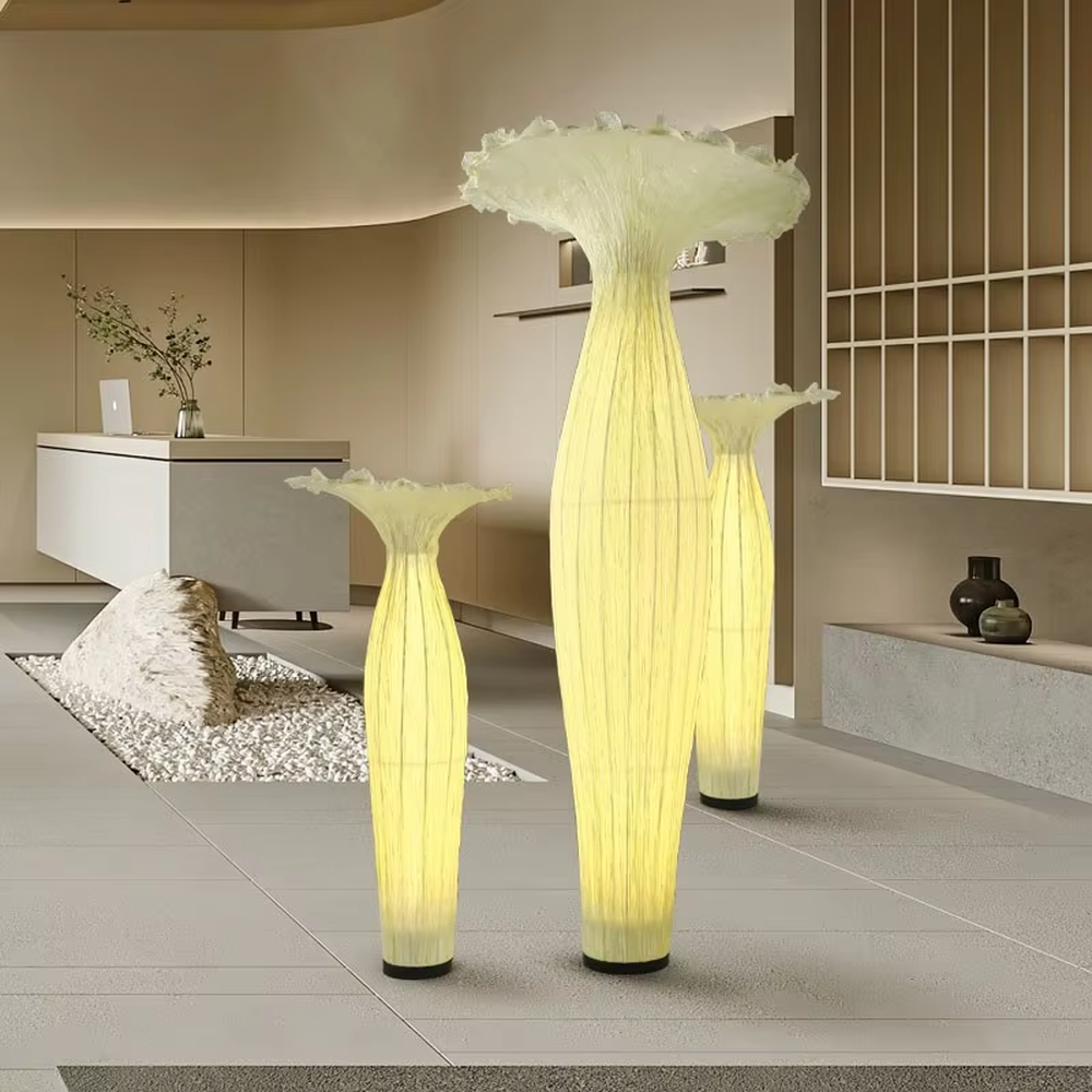 Modern art-style bud-shaped translucent floor lamp (size combination), textured material + warm yellow light effect, creating a soft artistic atmosphere.