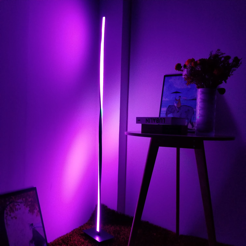 Modern fashion curved strip color-changing LED floor lamp, black frame + long strip LED light source + multi-color ambient light, soft light renders the space, creating a trendy fashion atmosphere.