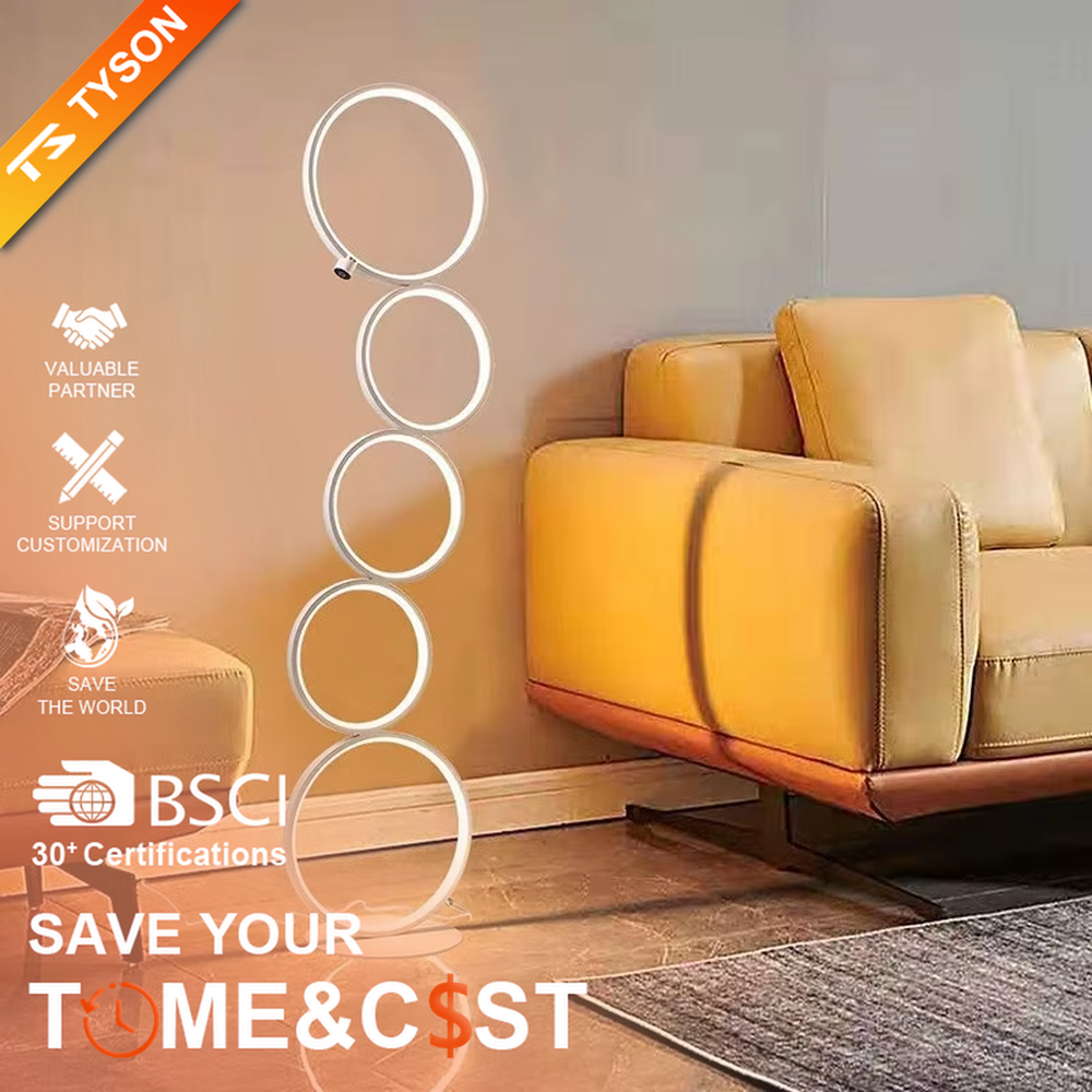 Modern art-style multi-layer luminous ring floor lamp, black frame + warm light ring light source + stacked shape, creating a simple artistic space atmosphere.