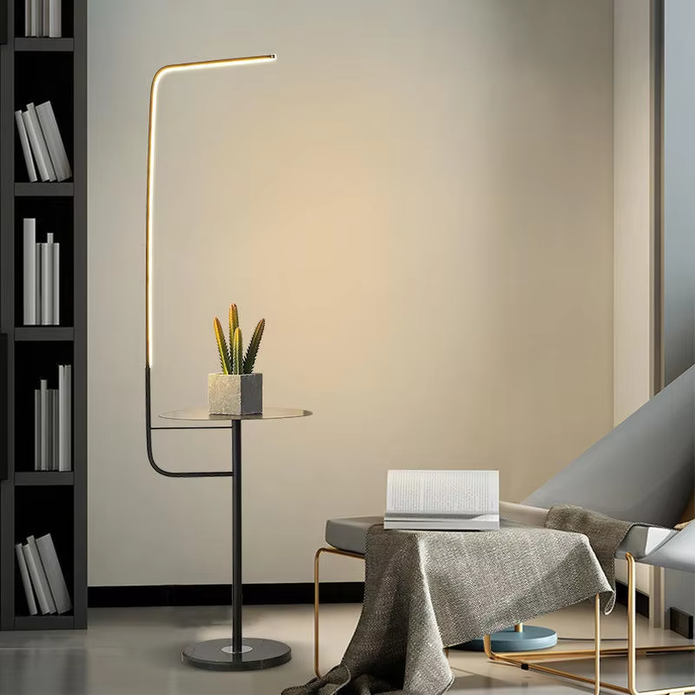 Light luxury golden L-shaped LED strip floor lamp with side table, gold metal stand + round small side table + white marble base, soft warm light, creating a high-end practical light luxury atmosphere.