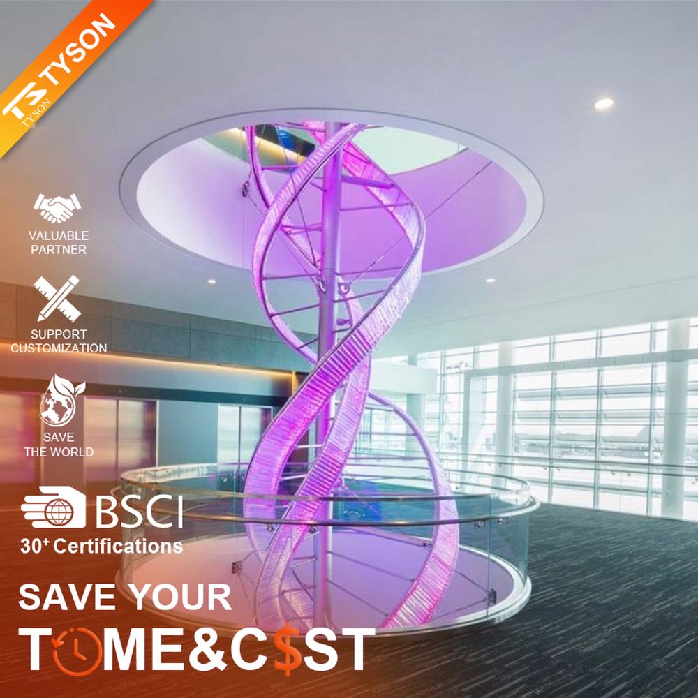 This is a large suspended art installation lamp, supported by a metal frame with blue-purple-cyan gradient LED light strips, featuring an abstract spiral and crescent shape, with both decorative and lighting functions, ideal as artistic decorative lighting for public spaces.