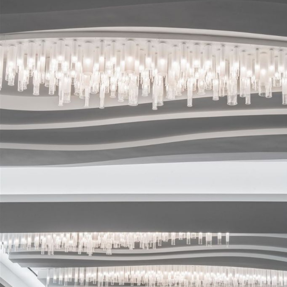 Modern Luxury Multi-layer Rectangular Crystal Chandelier, composed of transparent crystal strips and metal frames in a layered suspended design, serves both lighting and decorative purposes, ideal for hotel elevator lobbies, corridors, high-end office building lobbies and other public spaces.