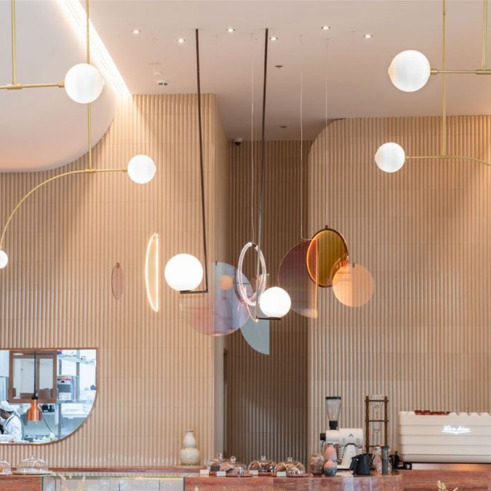 Modern Art Combination Pendant Light, Composed of Milk White Spherical Lamps, Colorful Translucent Disc Decorations and Copper Metal Frames, Serves Both Lighting and Decorative Purposes, Ideal for Art Galleries, Light Luxury Restaurants, Sales Centers, High-End Clubs, etc.