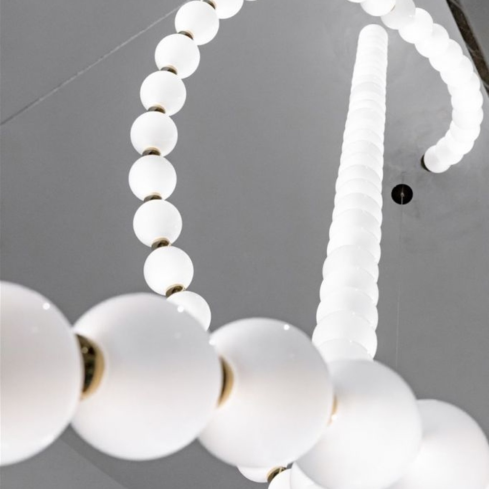 Modern Art Spiral Beaded Chandelier, Composed of Milk White Spherical Lamps Connected in a Spiral Shape Following Staircase Curves, with Gold Metal Details, Serves Both Lighting and Decorative Purposes, Ideal for Villa Spiral Staircases, High-Ceiling Halls, Luxury Hotel Lobbies, etc.
