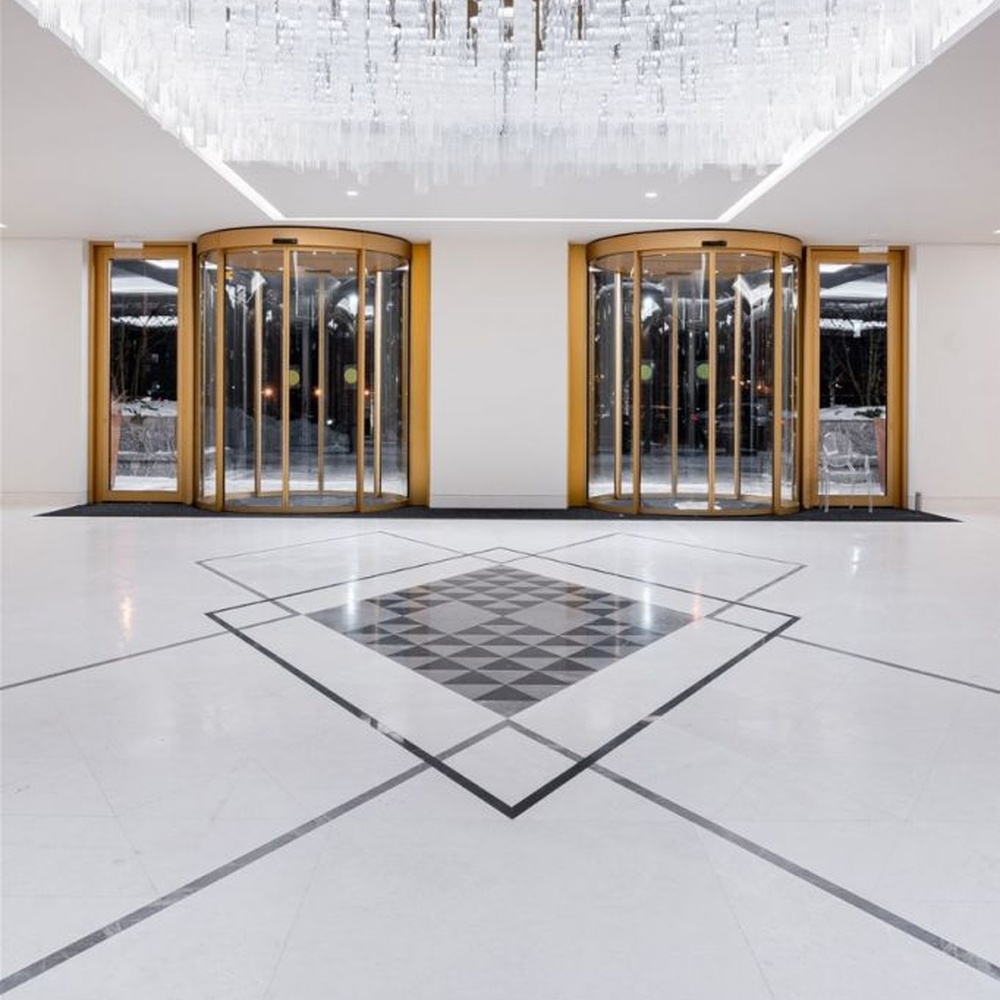 This is a luxurious large rectangular crystal pendant chandelier, composed of densely arranged transparent crystal strips, presenting a brilliant glossy effect, with both decorative and lighting functions, ideal for high-end high-ceiling public spaces such as hotel lobbies and office building entrances.