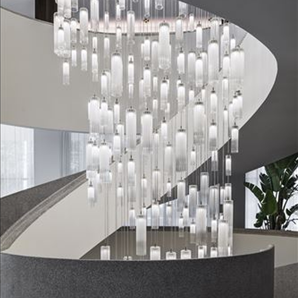 This is a modern minimalist large waterfall-style pendant chandelier, composed of densely hung transparent and translucent crystal tubes, presenting a dynamic flowing water shape, with both decorative and lighting functions, ideal for high-ceiling public spaces such as hotel lobbies and shopping mall atriums.