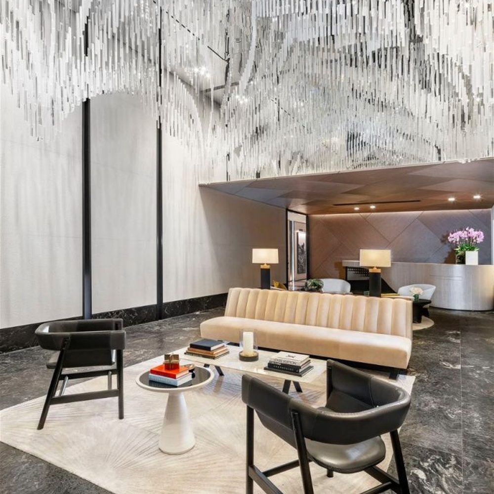 Modern Art Rain Curtain Crystal Chandelier, composed of numerous transparent crystal/acrylic strips suspended in a staggered arrangement, serves both lighting and decorative purposes, ideal for hotel lobbies, sales centers, high-end clubs and other high-ceiling public spaces.