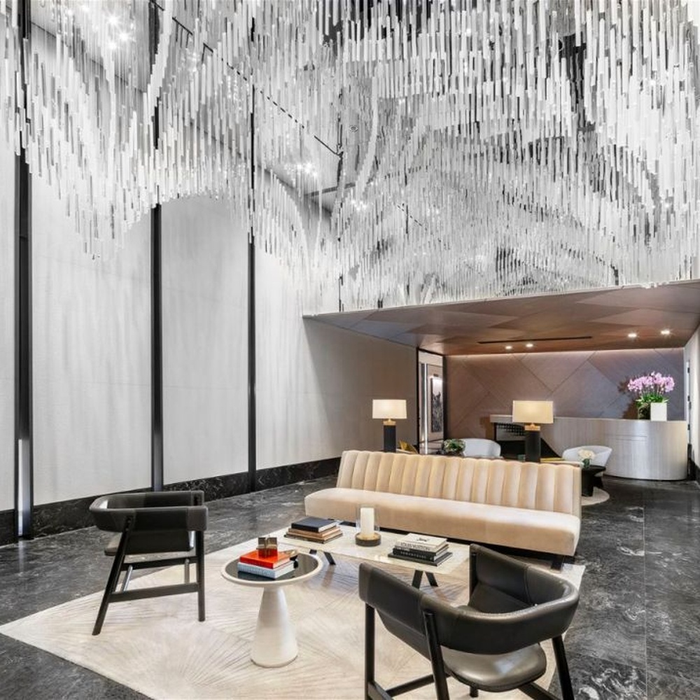 Modern Art Rain Curtain Crystal Chandelier, composed of numerous transparent crystal/acrylic strips suspended in a staggered arrangement, serves both lighting and decorative purposes, ideal for hotel lobbies, sales centers, high-end clubs and other high-ceiling public spaces.