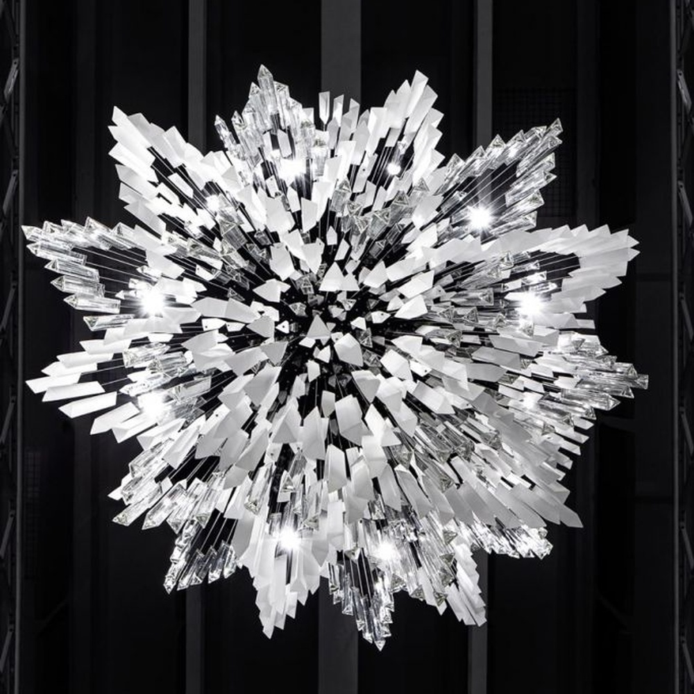 This modern industrial-style art chandelier consists of a large number of white acrylic strips hung staggered by metal wires, extending downward in a waterfall shape from a circular ceiling plate. Light passes through the strips to emit a transparent and soft halo, serving both lighting and decorative purposes, suitable for high-ceiling commercial spaces such as cultural and creative parks and art exhibition halls.