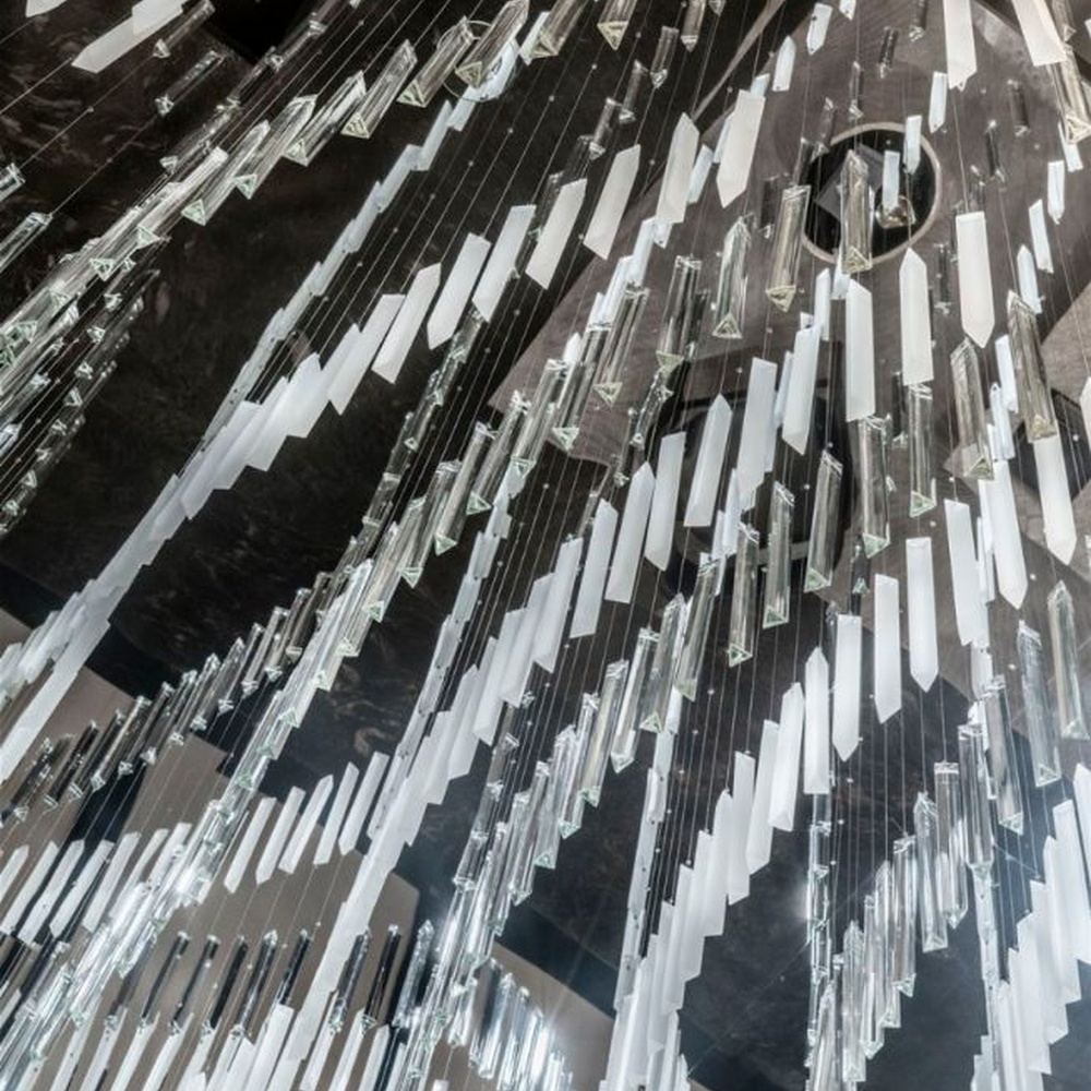 Modern Art Rain Curtain Crystal Chandelier, composed of numerous transparent crystal/acrylic strips suspended in a staggered arrangement, serves both lighting and decorative purposes, ideal for hotel lobbies, sales centers, high-end clubs and other high-ceiling public spaces.