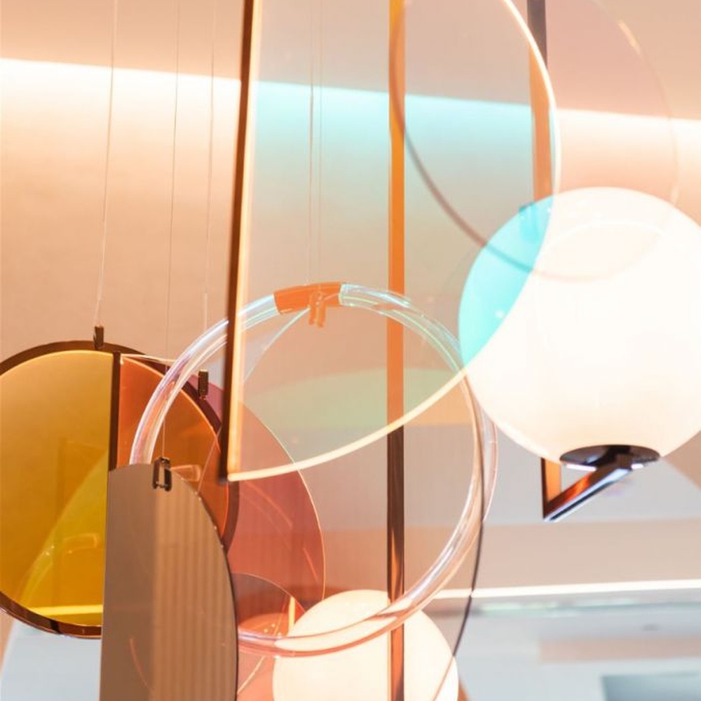 Modern Art Combination Pendant Light, Composed of Milk White Spherical Lamps, Colorful Translucent Disc Decorations and Copper Metal Frames, Serves Both Lighting and Decorative Purposes, Ideal for Art Galleries, Light Luxury Restaurants, Sales Centers, High-End Clubs, etc.