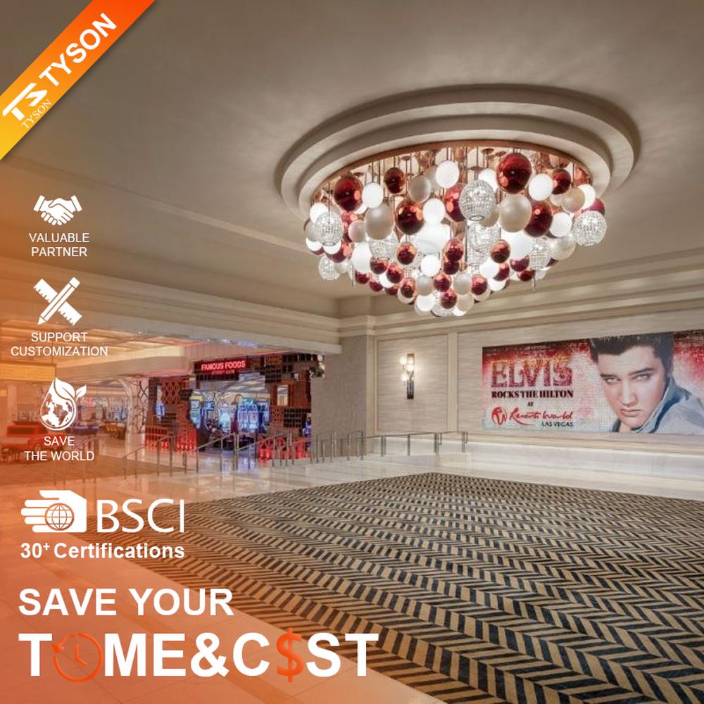 This is a modern luxury style cluster spherical chandelier, composed of red, white and silver glass balls arranged in a staggered manner, embedded in a circular ceiling structure, which has both lighting and artistic decoration functions, suitable for large commercial spaces such as hotel lobbies, shopping mall atriums, and high-end clubs.