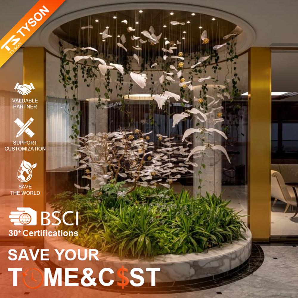 This is a natural-style suspended art installation lamp, composed of transparent ripple-shaped leaves and gold accents, creating an immersive scene with dead trees and green plants, with both decorative and lighting functions, ideal for weddings, high-end restaurants, art galleries and other scenarios.