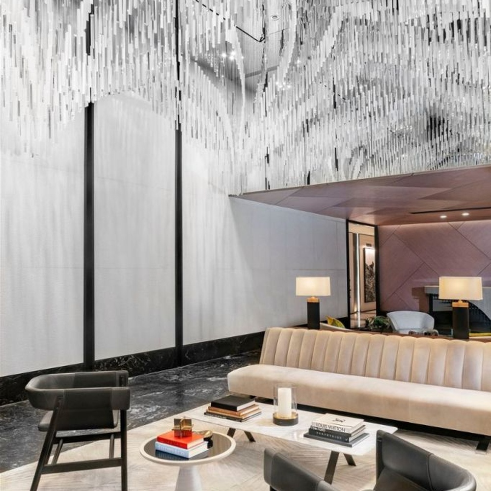 Modern Art Rain Curtain Crystal Chandelier, composed of numerous transparent crystal/acrylic strips suspended in a staggered arrangement, serves both lighting and decorative purposes, ideal for hotel lobbies, sales centers, high-end clubs and other high-ceiling public spaces.