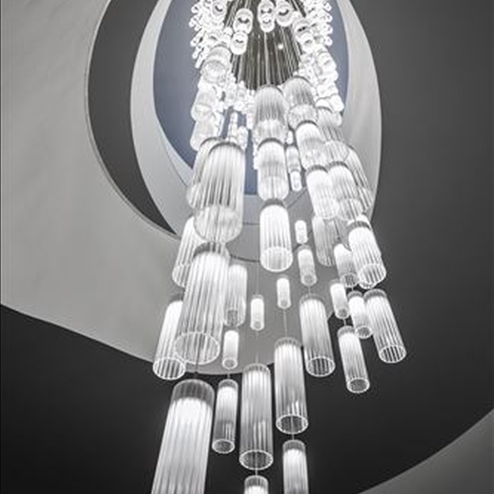 This is a modern minimalist large waterfall-style pendant chandelier, composed of densely hung transparent and translucent crystal tubes, presenting a dynamic flowing water shape, with both decorative and lighting functions, ideal for high-ceiling public spaces such as hotel lobbies and shopping mall atriums.