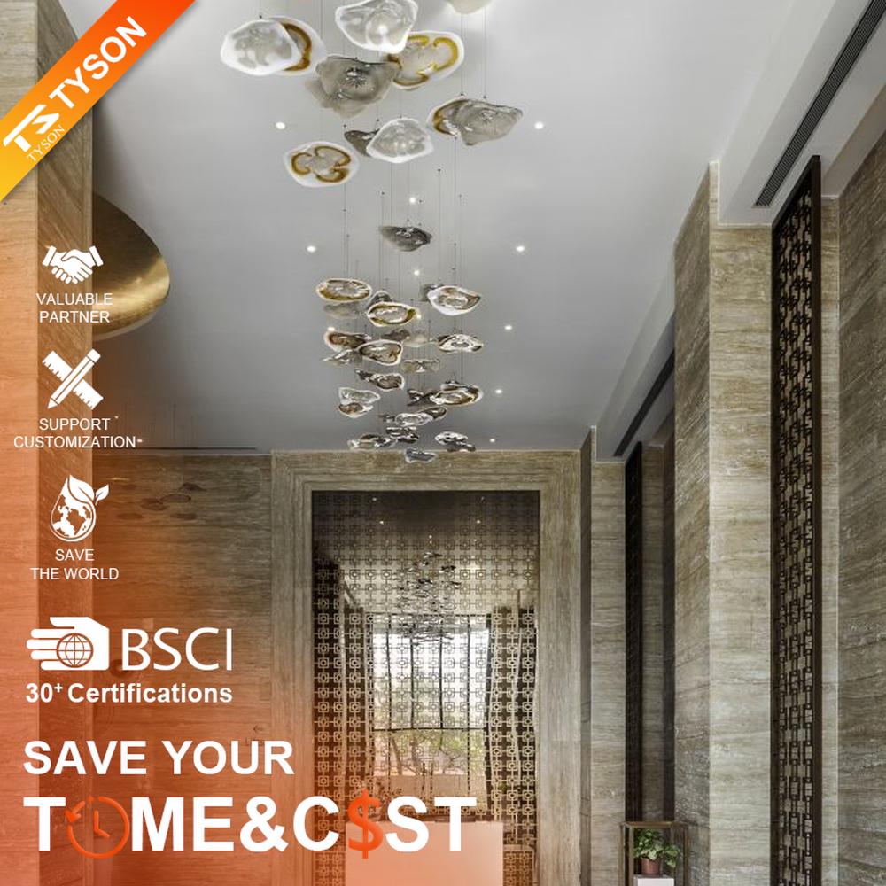 This modern art cloud-slice chandelier consists of irregular transparent and gold cloud-shaped ornaments hung staggered, as light as floating clouds. Light passes through the ornaments to emit a soft and transparent halo, serving both lighting and decorative purposes, suitable for high-end commercial spaces such as luxury sales offices and clubs.