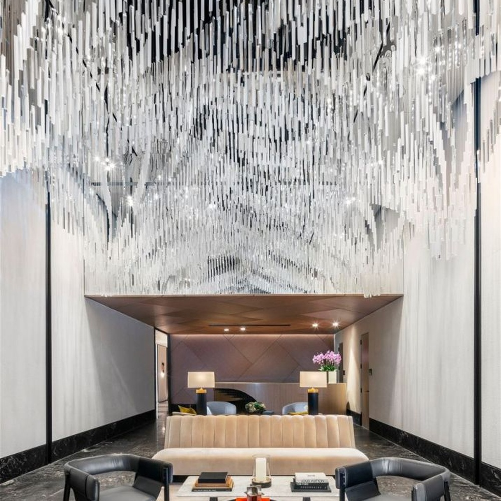 Modern Art Rain Curtain Crystal Chandelier, composed of numerous transparent crystal/acrylic strips suspended in a staggered arrangement, serves both lighting and decorative purposes, ideal for hotel lobbies, sales centers, high-end clubs and other high-ceiling public spaces.