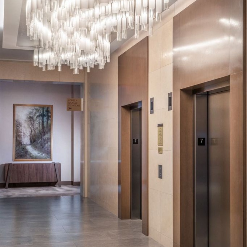 Modern Luxury Multi-layer Rectangular Crystal Chandelier, composed of transparent crystal strips and metal frames in a layered suspended design, serves both lighting and decorative purposes, ideal for hotel elevator lobbies, corridors, high-end office building lobbies and other public spaces.