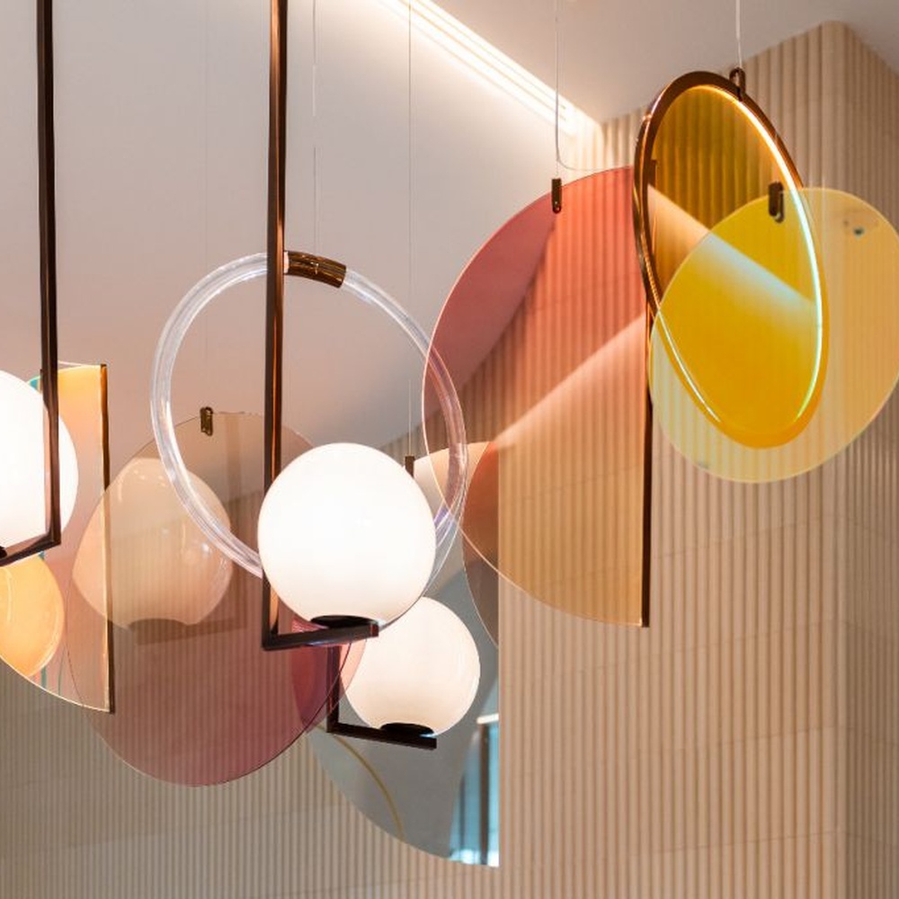 Modern Art Combination Pendant Light, Composed of Milk White Spherical Lamps, Colorful Translucent Disc Decorations and Copper Metal Frames, Serves Both Lighting and Decorative Purposes, Ideal for Art Galleries, Light Luxury Restaurants, Sales Centers, High-End Clubs, etc.