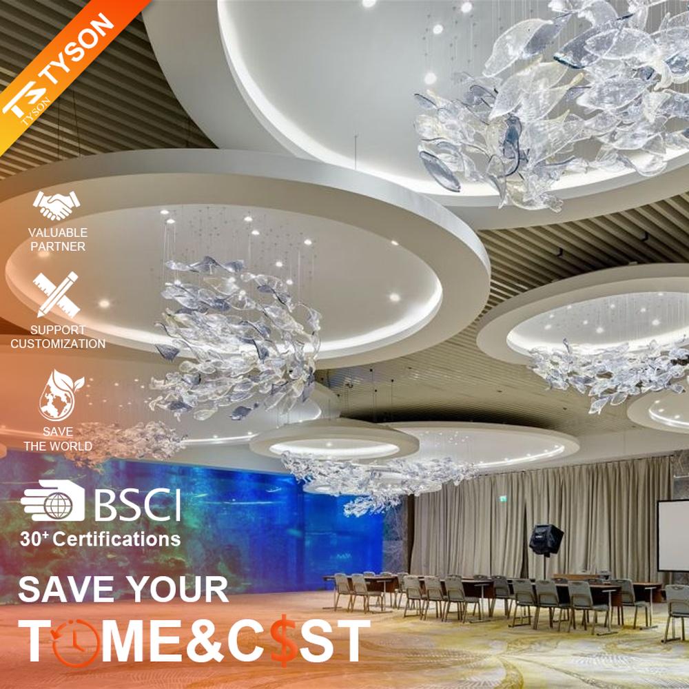 This modern artistic bird-shaped chandelier consists of transparent and gradient blue-purple leaf-shaped glass ornaments hung staggered, arranged in an arc streamline, with point light sources to create a dynamic visual effect, serving both lighting and decorative purposes, suitable for high-end commercial spaces such as luxury sales offices and hotel lobbies.
