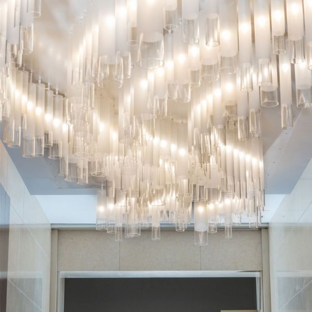 Modern Luxury Multi-layer Rectangular Crystal Chandelier, composed of transparent crystal strips and metal frames in a layered suspended design, serves both lighting and decorative purposes, ideal for hotel elevator lobbies, corridors, high-end office building lobbies and other public spaces.
