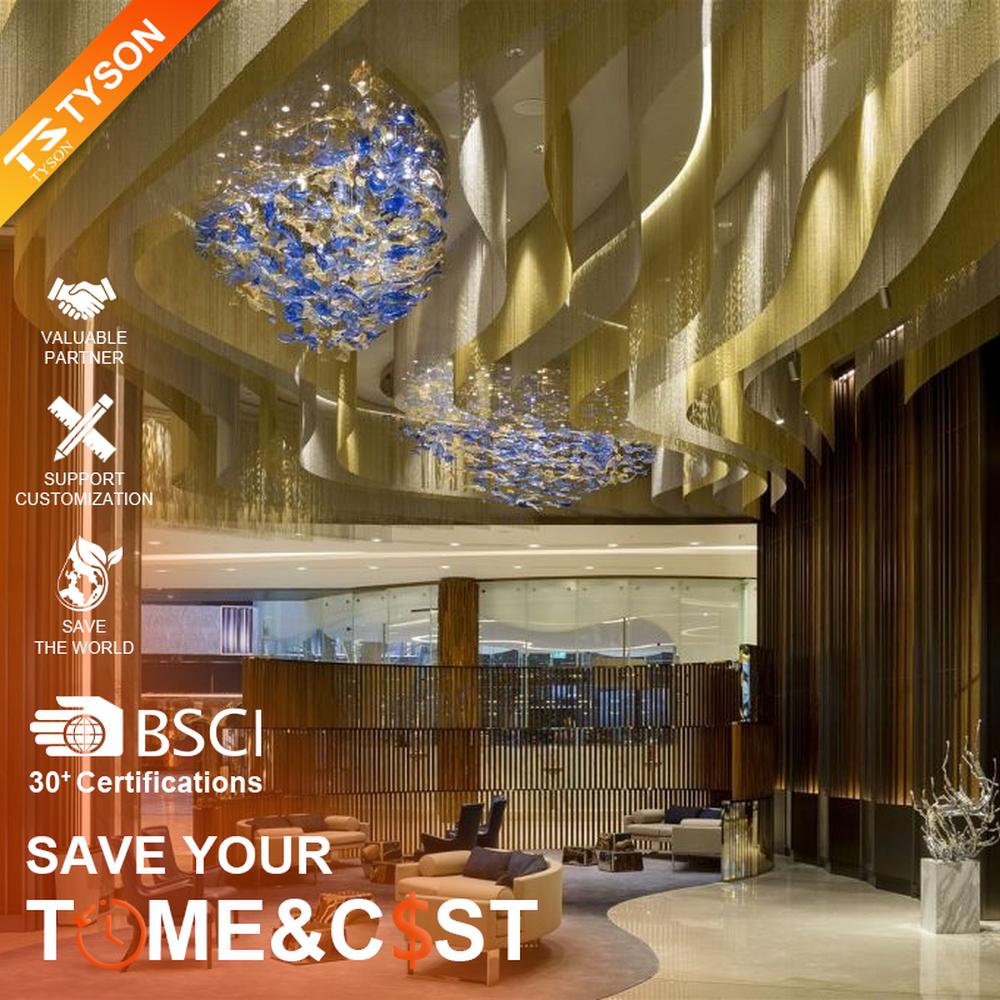 This blue-gold gradient liuli leaf art chandelier is made of liuli leaf-shaped ornaments, layered to create a flowing visual effect. Light refracts through to emit a colorful halo, serving both lighting and installation art purposes, suitable for luxury spaces such as hotel lobbies and high-end clubs.