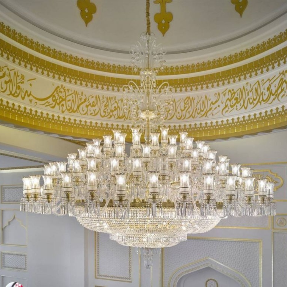 This Islamic-style large multi-layer crystal chandelier features a luxurious shape made of a gold metal frame and faceted crystals, with light refracting a brilliant halo through the crystals, serving both lighting and decorative purposes, suitable for luxurious religious or commercial spaces such as mosques and high-end hotel lobbies.