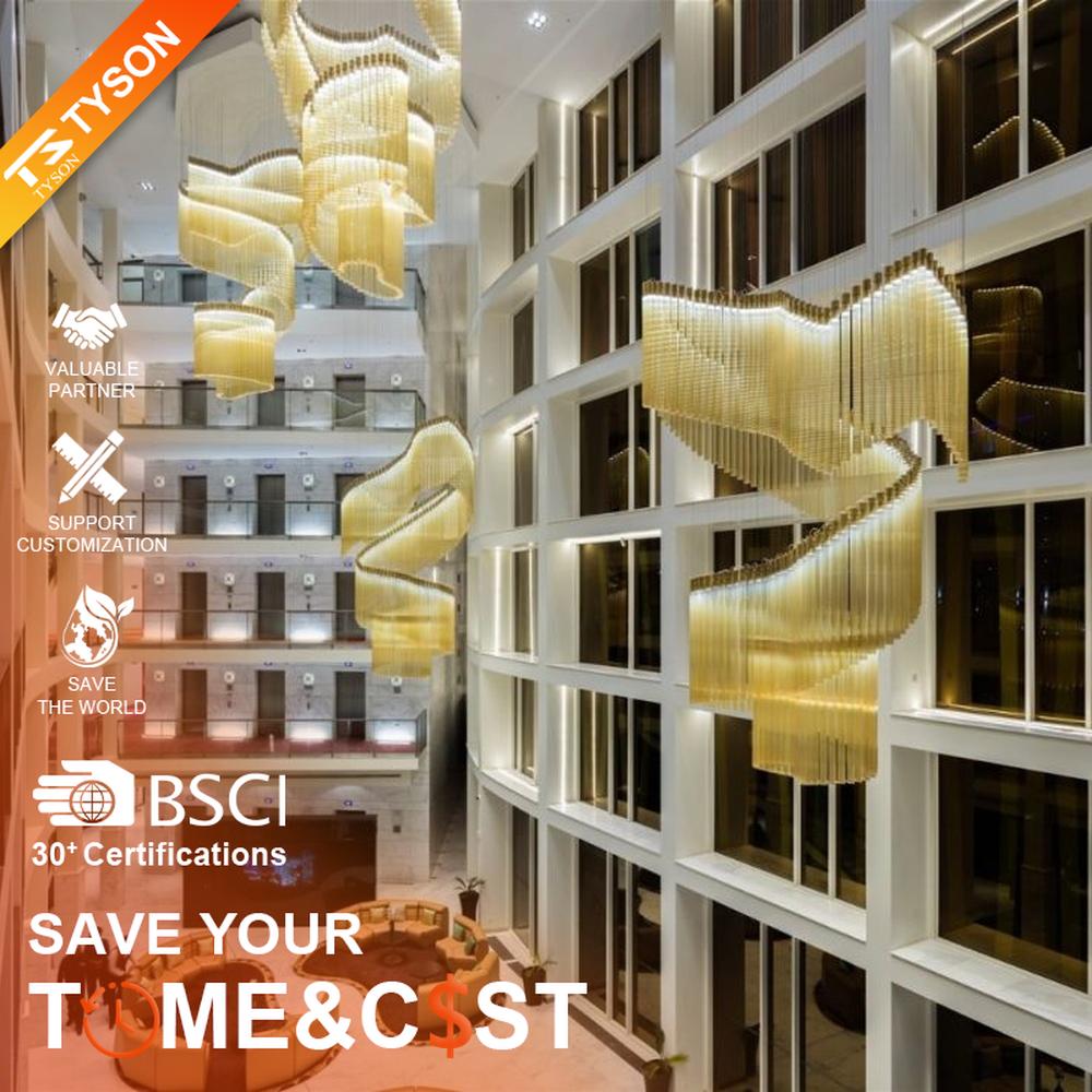 This gilded wave art chandelier is composed of layered gold acrylic strips forming a flowing wave shape, like floating golden ribbons, serving both lighting and installation art purposes, suitable for high-ceiling commercial spaces such as hotel lobbies and convention centers.