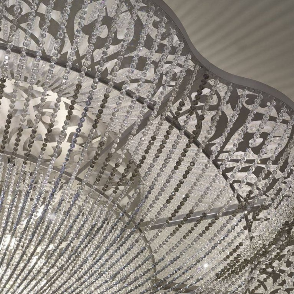 This large petal-shaped crystal ceiling lamp consists of radial crystal strips forming a hollow petal shape, with light refracting a brilliant halo through it, serving both lighting and decorative purposes, suitable for high-end luxury spaces such as hotel banquet halls and large clubs.