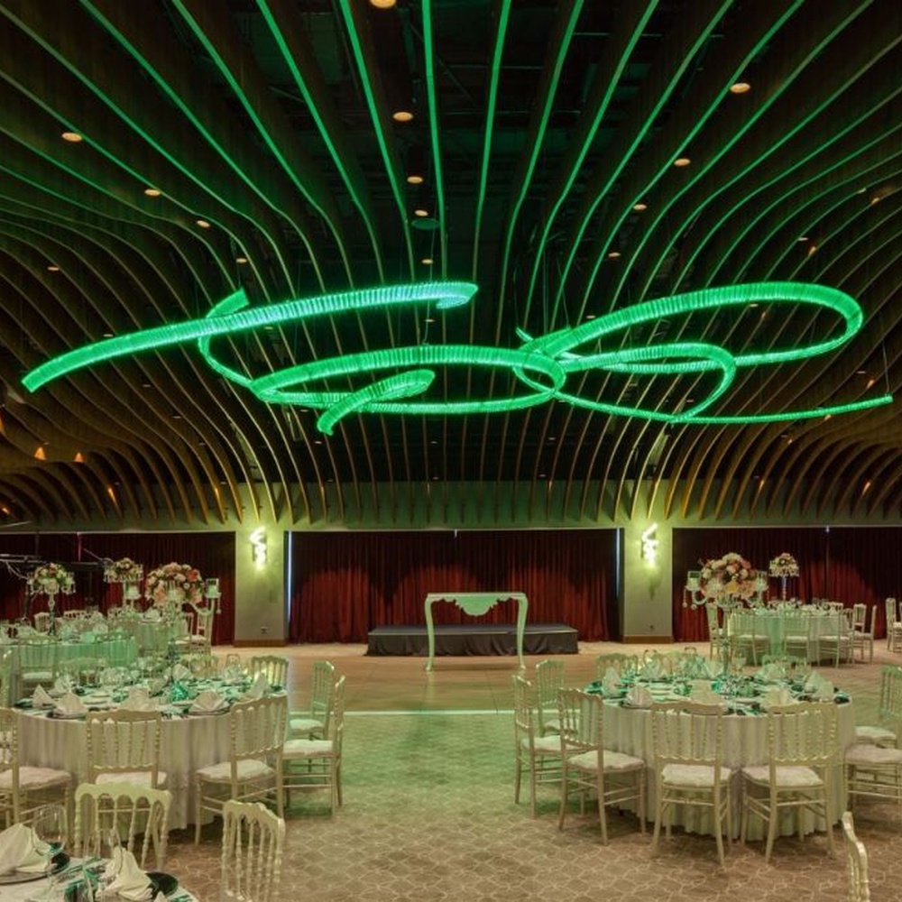 This red spiral crystal art chandelier is composed of red crystal strips spliced into a flowing spiral shape. Light refracts through to emit a brilliant halo, serving both lighting and installation art purposes, suitable for trendy commercial spaces such as bars and clubs.