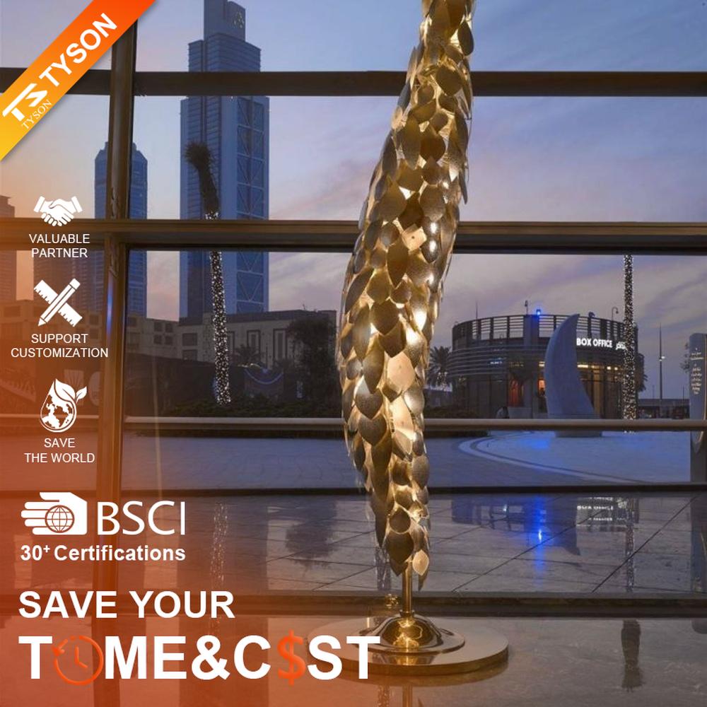 This light luxury art sculpture floor lamp features a twisted scale shape made of metal, with warm light refracting a luxurious halo through the metal texture, serving both lighting and decorative purposes, suitable for luxury spaces such as high-end hotel lobbies and clubs.