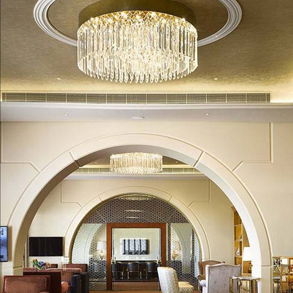 This light luxury round tassel crystal ceiling lamp features a circular drooping shape made of a metal frame and multi-layer faceted crystal strips, with light refracting a brilliant halo through the crystals, serving both lighting and decorative purposes, suitable for high-end luxury spaces such as hotel lobbies and clubs.