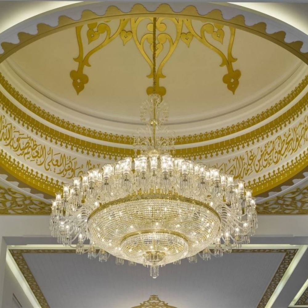 This Islamic-style large multi-layer crystal chandelier features a luxurious shape made of a gold metal frame and faceted crystals, with light refracting a brilliant halo through the crystals, serving both lighting and decorative purposes, suitable for luxurious religious or commercial spaces such as mosques and high-end hotel lobbies.