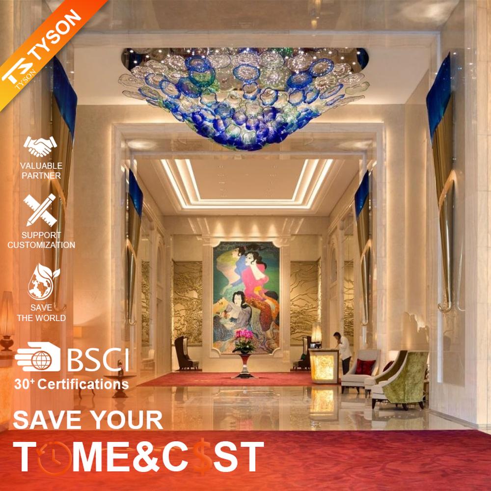 This blue-green gradient liuli bubble art ceiling lamp is composed of layered liuli bubbles forming a cloud shape. Light refracts through to emit a colorful halo, serving both lighting and installation art purposes, suitable for luxury spaces such as hotel lobbies and high-end clubs.