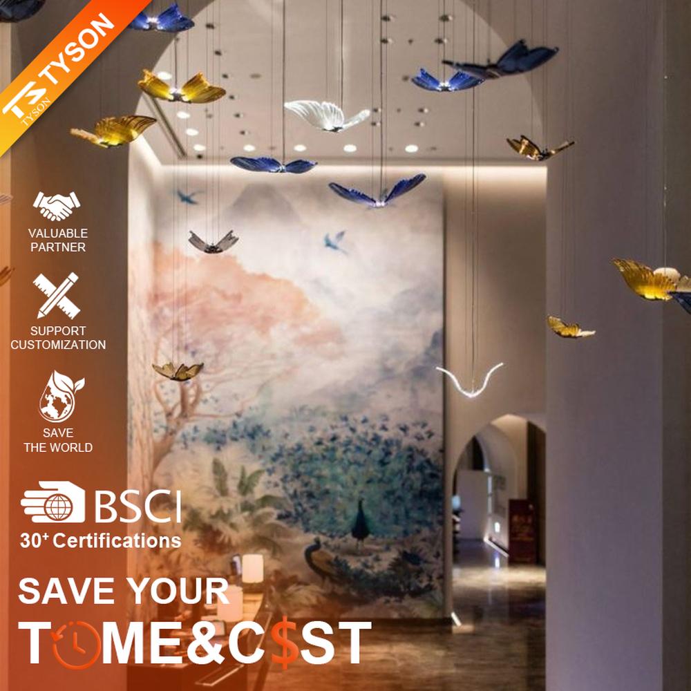 Modern artistic butterfly-shaped suspended chandelier, made of colored glass/acrylic to create a realistic butterfly form, paired with adjustable metal suspension rods, combining decorative and ambient lighting functions, suitable for hotel lobbies, high-end clubs, art exhibition halls and other spaces.