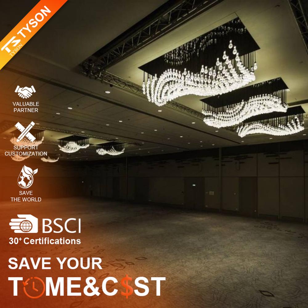 Modern artistic wavy hanging crystal chandelier, with a black metal frame and dense crystal particles creating a flowing wavy shape, combining decorative and main lighting functions, suitable for large-scale commercial spaces such as large banquet halls, exhibition centers, and high-end clubs.