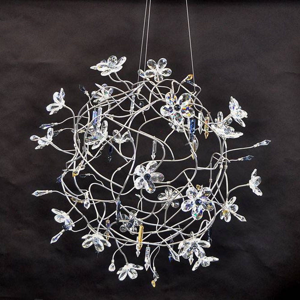 Modern artistic dandelion-shaped chandelier, with metal branches and crystal/glass particles creating a radial spherical structure, featuring bright and soft light, combining decorative and lighting functions, suitable for living rooms, dining rooms, high-end clubs and other modern art style spaces.