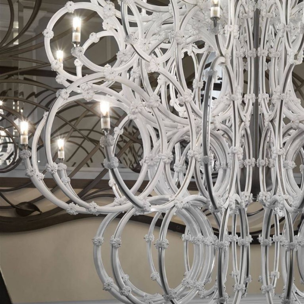 This large white crystal corolla art chandelier is handcrafted with high-transparency glass/crystal into a layered, curled ring structure, forming a blooming corolla shape, with brilliant and soft light, serving both lighting and decorative purposes, suitable for high-end high-ceiling spaces such as villa high-ceiling living rooms and hotel lobbies.