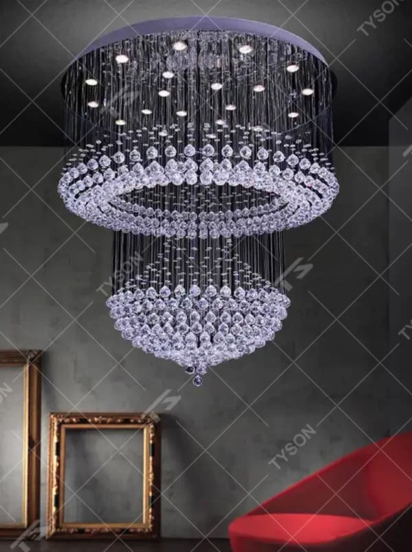 This is a multi-layered cascading crystal ceiling light, composed of numerous stacked crystal beads and components. It has a three-dimensional and layered shape, translucent and brilliant under light. It is used for space lighting and luxurious decoration, combining practicality and artistry to significantly enhance the space’s grade. It is suitable for high-end hotel lobbies, luxury villa living rooms, large banquet halls and other high-end places.