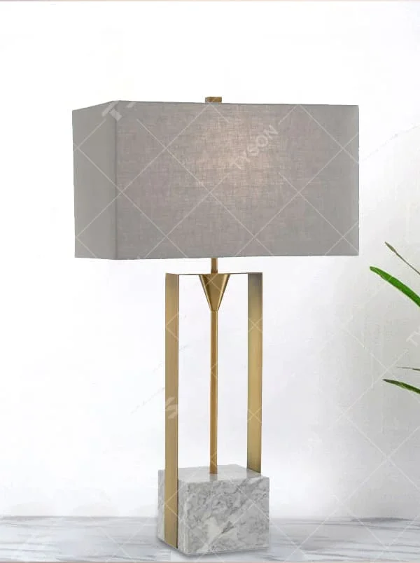 This is a modern minimalist table lamp with a golden metal frame, a marble base, and a gray fabric square lampshade, featuring a simple and elegant design. It is used for local desktop lighting and decoration, combining practicality and aesthetics. It is suitable for modern home living room side tables, bedroom bedside tables, high-end hotel guest rooms, luxury office spaces and other places.