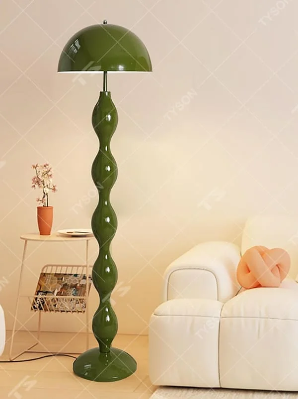 This is a modern artistic floor lamp with an olive green wavy lamp pole and a dome lampshade, featuring a unique and dynamic design. It is used for space lighting and decoration, creating a warm and artistic ambiance. It is suitable for modern home bedrooms, living rooms, characteristic homestays, art apartments and other places.