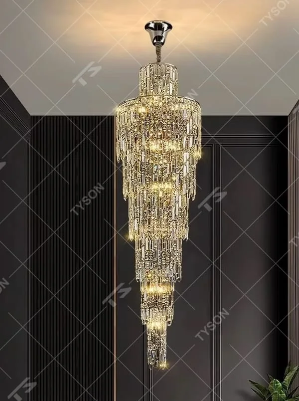 This is a luxury conical multi-layer crystal chandelier, with transparent crystal components hanging in a conical multi-layer shape, brilliant lighting, featuring extremely luxurious sense and visual impact. It is used for space lighting and decoration, creating a high-end luxury atmosphere. It is suitable for duplex stairwells, high-ceilinged living rooms, high-end hotel lobbies and other places.