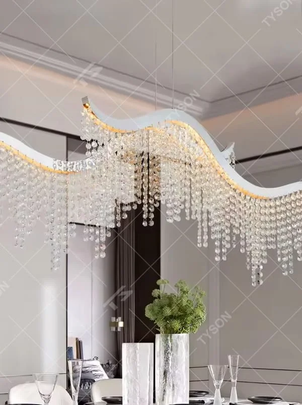 This is a modern wave-shaped crystal chandelier, with a white wave-shaped frame and multi-layer transparent crystal pendants, brilliant lighting, featuring a luxurious and grand design with strong visual appeal. It is used for space lighting and decoration, creating a high-end luxury atmosphere. It is suitable for high-end restaurants, luxury-style home living rooms, luxury clubs and other places.