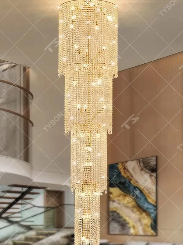 This is a luxury multi-layer cylindrical crystal chandelier, with a golden metal frame and multi-layer transparent crystal pendants, brilliant lighting, featuring a magnificent and grand design with strong visual impact. It is used for space lighting and decoration, creating a high-end luxury atmosphere. It is suitable for duplex stairwells, high-ceilinged living rooms, high-end hotel lobbies and other places.