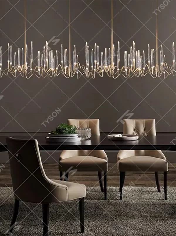 This is a modern artistic luxury chandelier, with a golden metal curved frame and transparent glass tube - shaped lampshades, featuring artistic layers and strong luxury sense. It is used for space lighting and decoration, creating an artistic luxury atmosphere. It is suitable for high - end restaurants, modern luxury home living rooms, art soft decoration spaces and other places.