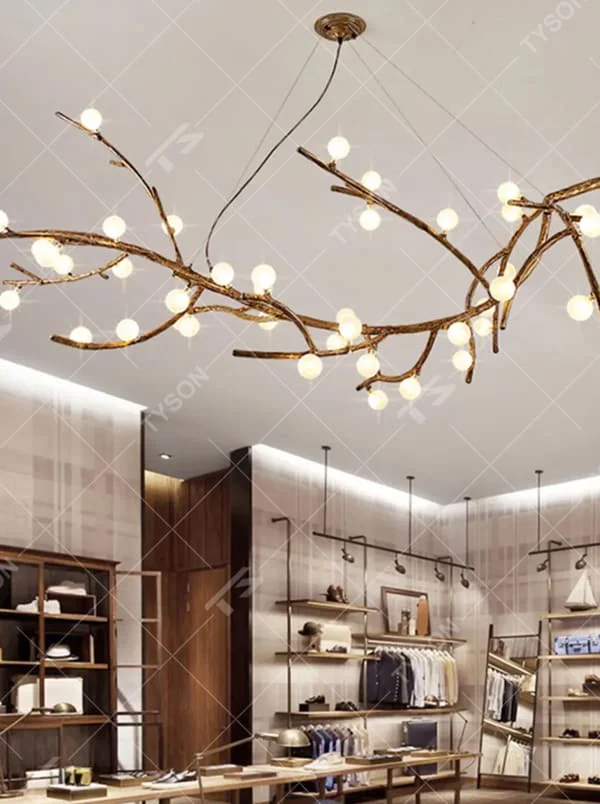 This is a natural artistic branch-shaped chandelier with a golden branch-like frame and multiple spherical lampshades, featuring a natural and flexible design with artistic sense. It is used for space lighting and decoration, creating a natural luxury atmosphere. It is suitable for Nordic-style home living rooms, art homestays, creative studios and other places.